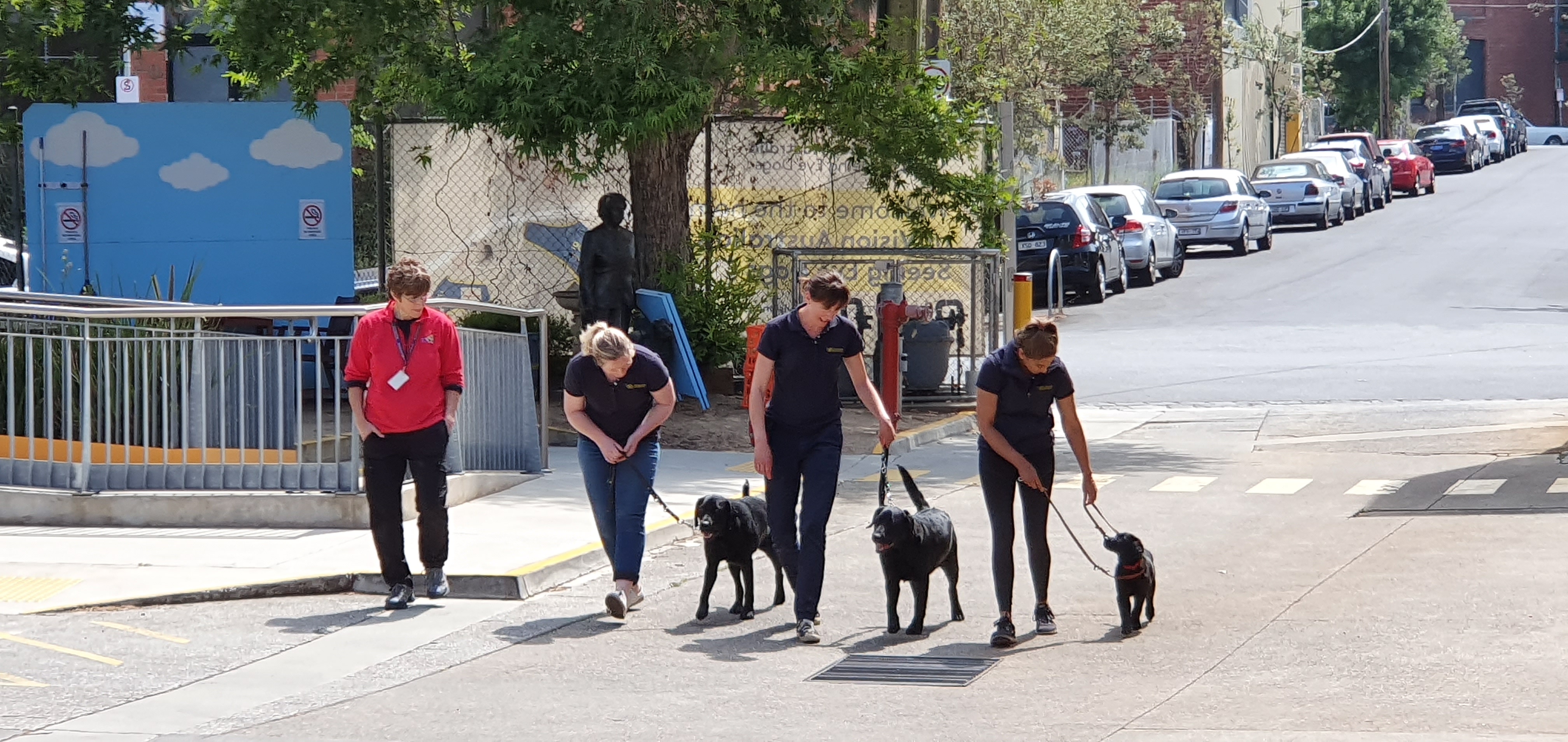 Jane Russenberger leads a physical demonstration with Seeing Eye Dogs staff in our car park.