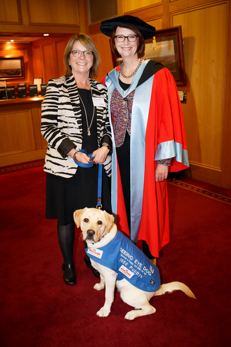 "Moira and a fully grown Farrow standing with former Prime Minister Julia Gillard."