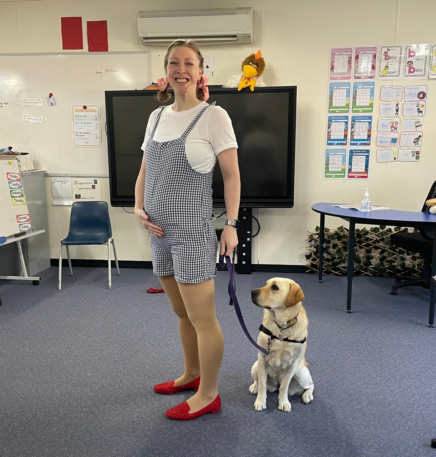 "Amanda and Lady in the classroom. Amanda is dressed up as Dorothy from The Wizard of Oz"